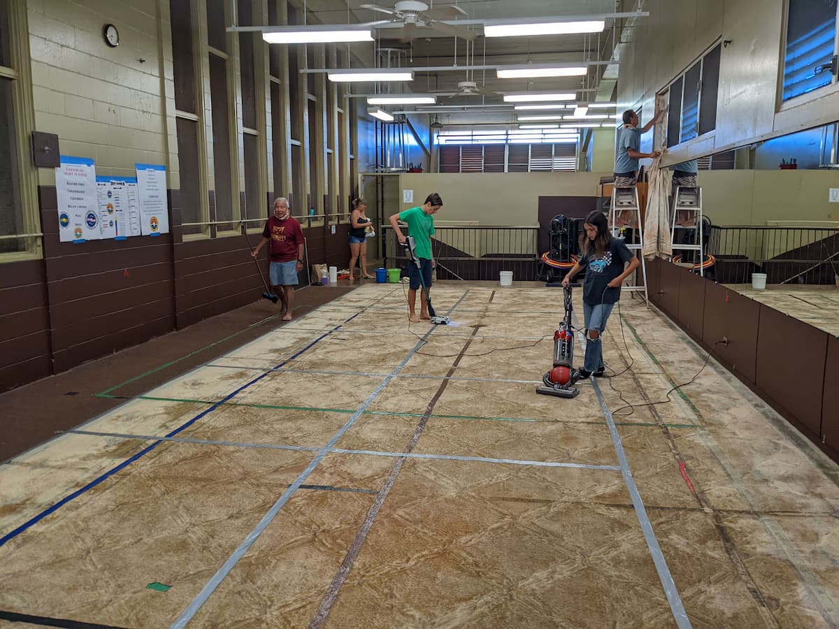 Dojo volunteers help clean the dojo space